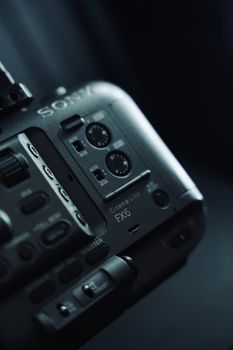 Detailed view of a cinema camera with focus on dials and controls, capturing the intricate design.