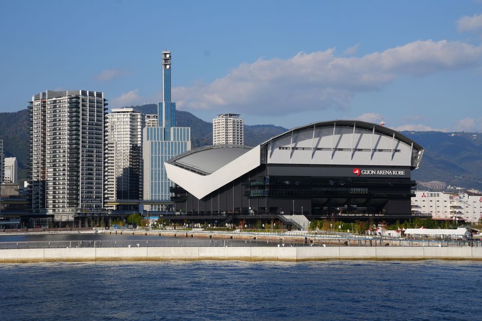 An impressive view of the Glion Arena Kobe, framed by modern skyscrapers in Kobe, Japan.