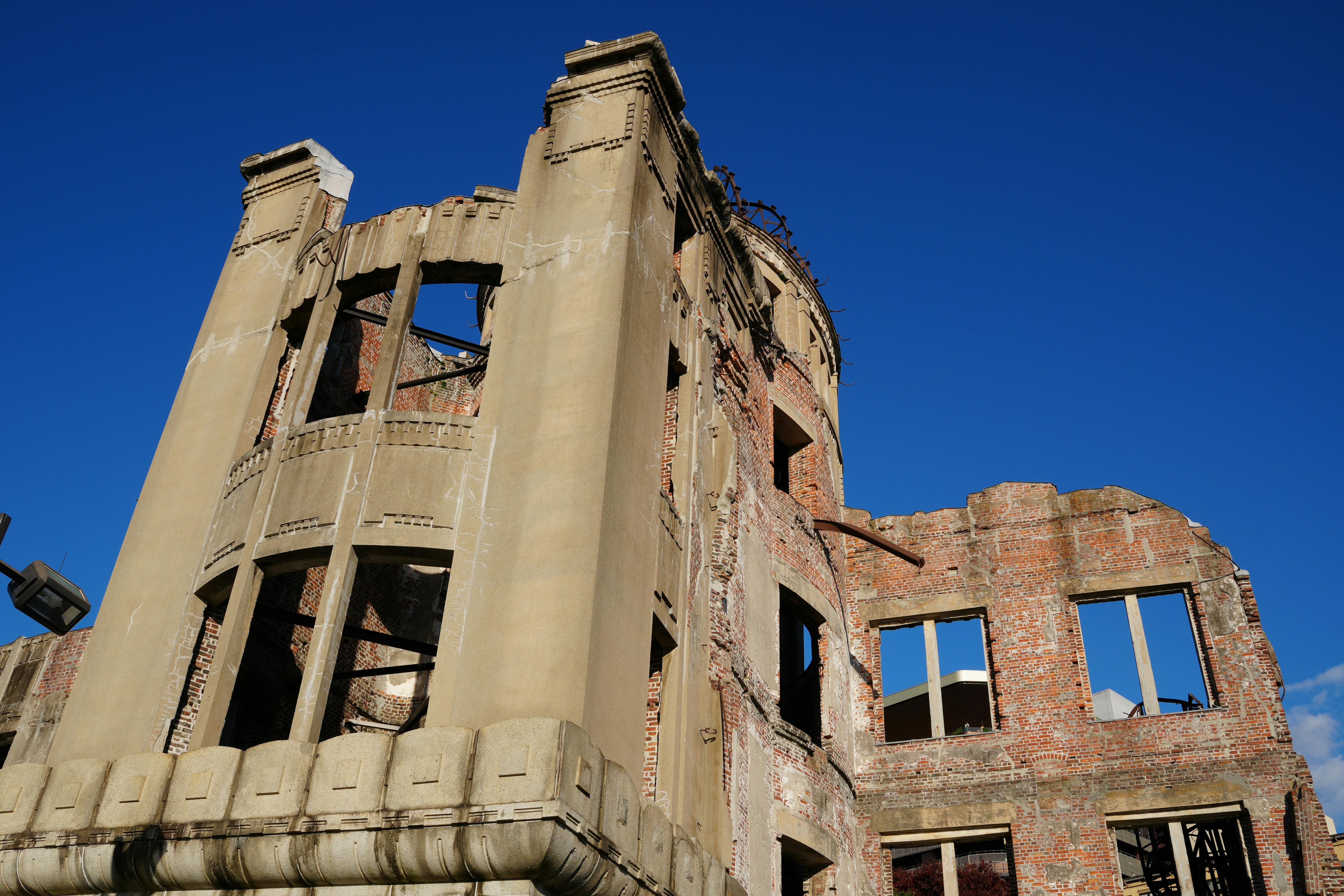 The Hiroshima Atomic Bomb Dome against a clear blue sky, symbolizing peace and history.