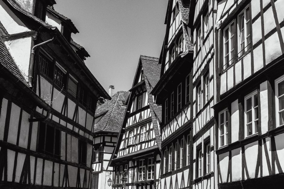Historical half-timbered houses in Strasbourg's old town, captured in black and white for a timeless feel.