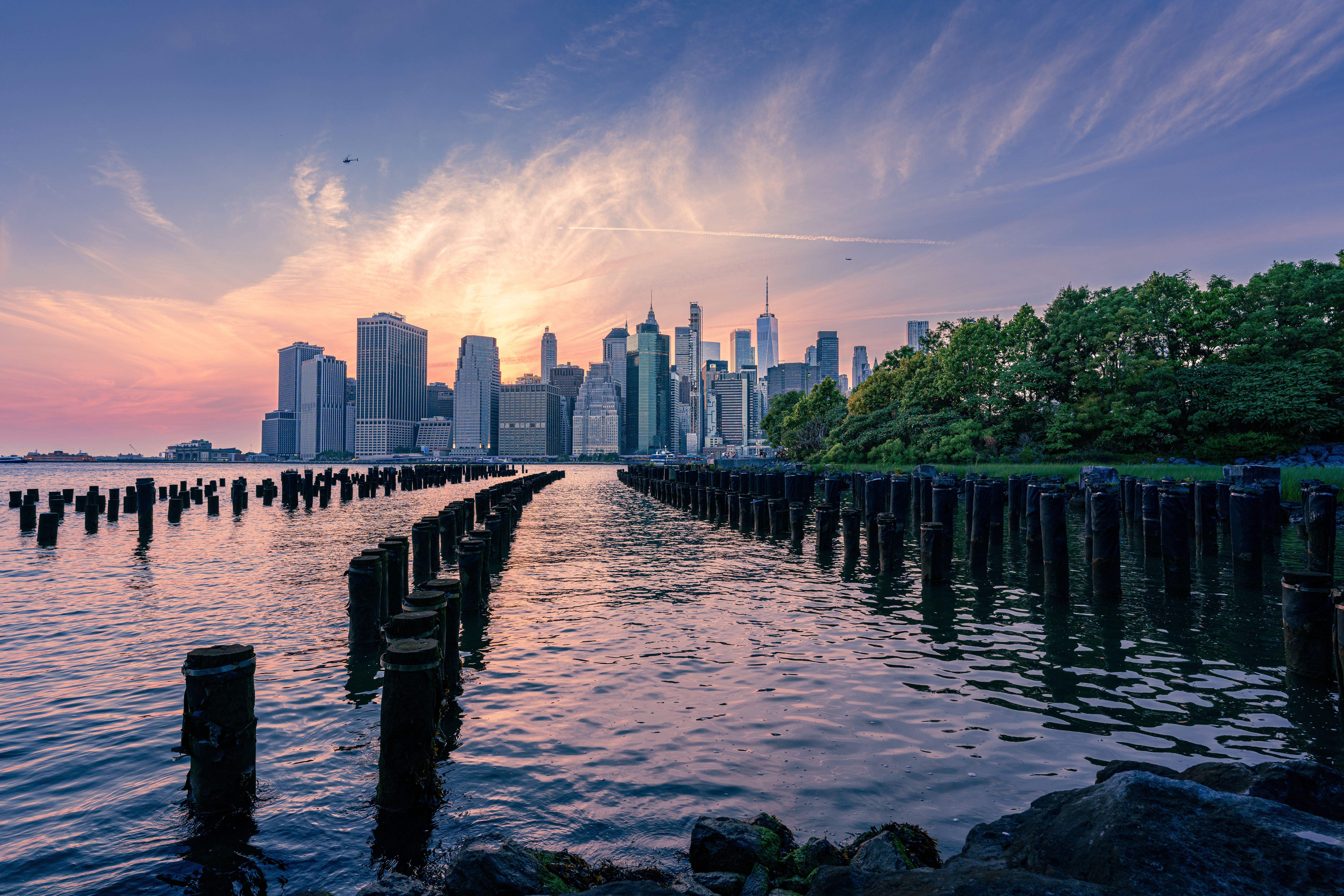 Sunset Over Manhattan Skyline from Brooklyn Bridge Park · Free Stock Photo
