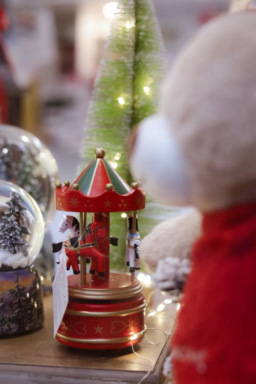 Free Close-up of a holiday nutcracker carousel with festive decor and soft lighting. Stock Photo