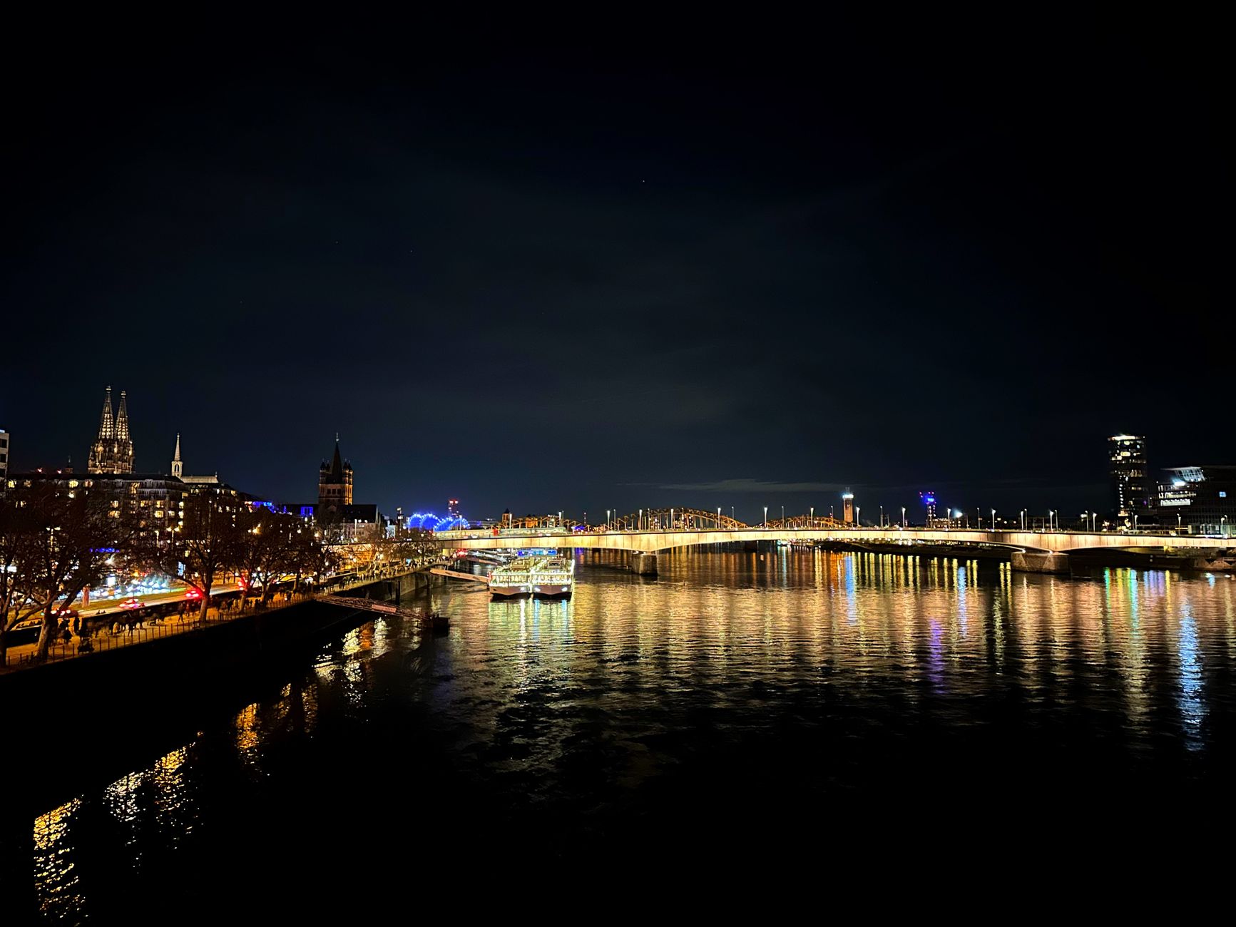 Cologne Rhine river evening walk with city skyline