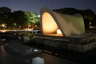 Illuminated Hiroshima Peace Memorial Park captured at night, serene and hauntingly beautiful.