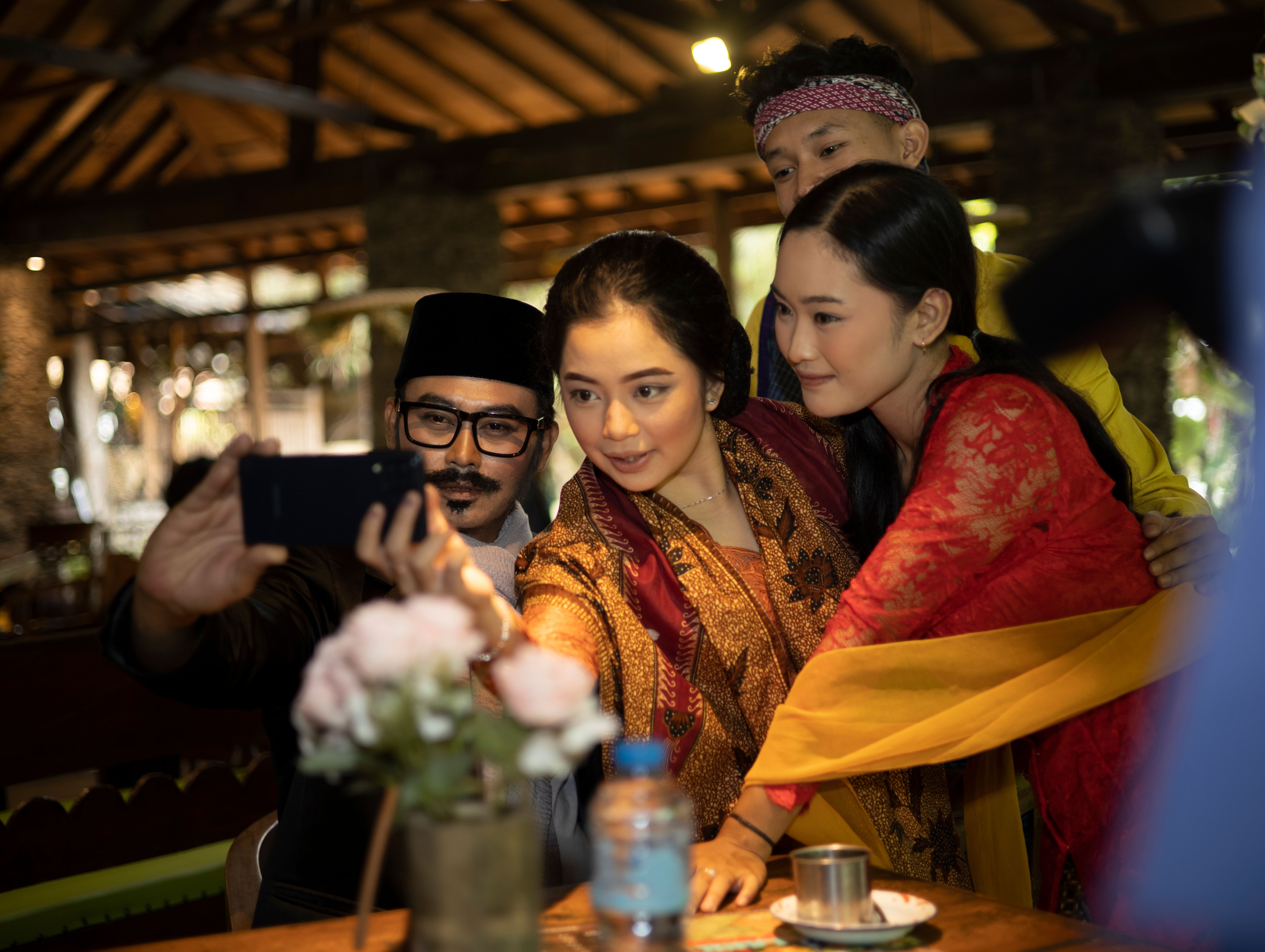 Group taking selfie at festive gathering