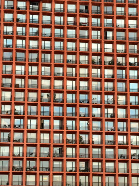 Grid Pattern Window Building Symmetrical Red Building Facade with Grid Windows · Free Stock Photo