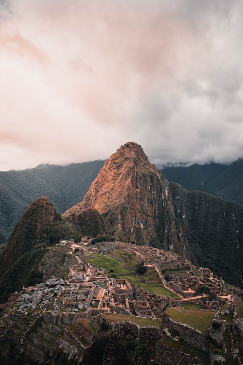 Brown Rocky Mountain Under White Cloudy Sky