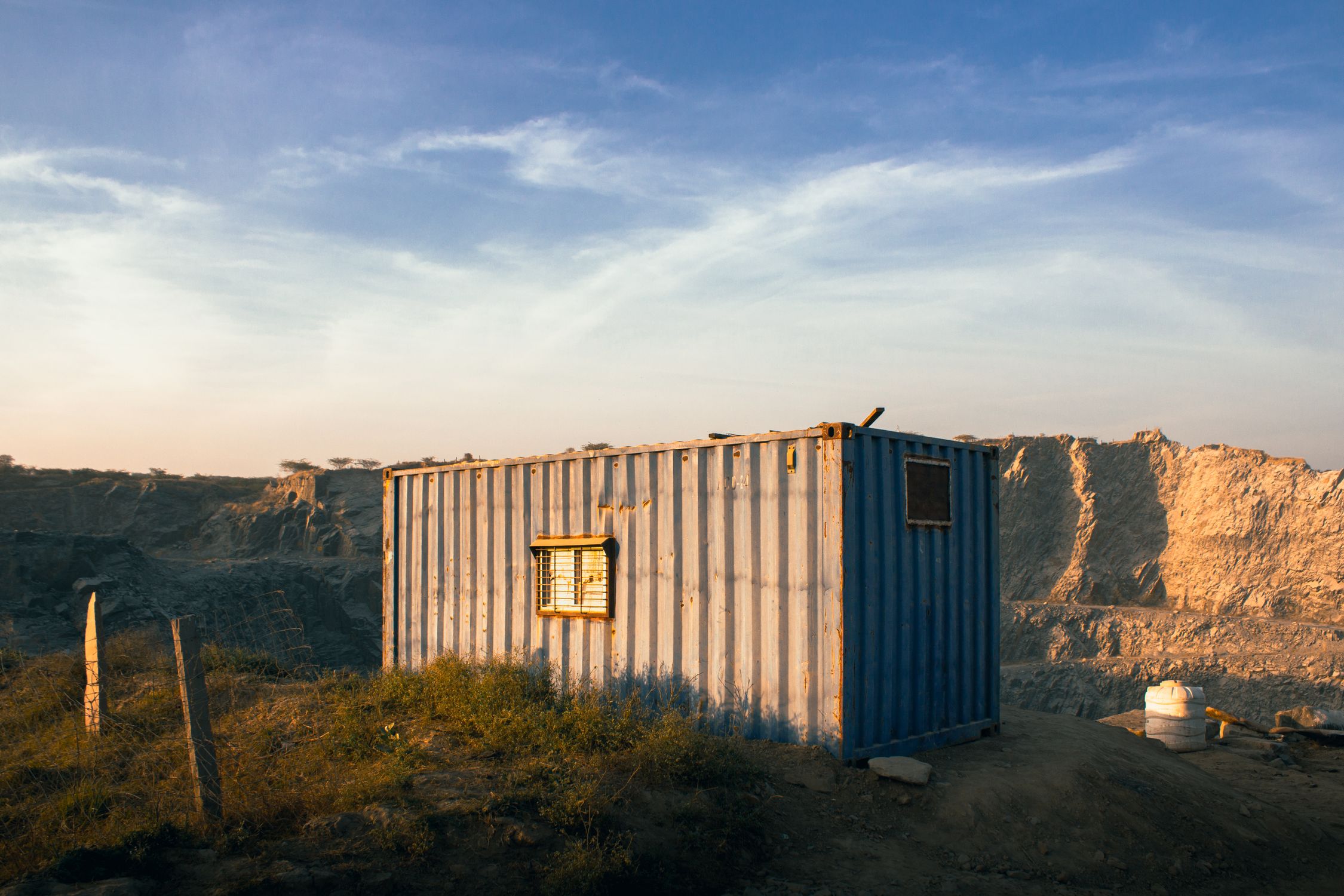 Rustic Blue Container in Desert Landscape · Free Stock Photo