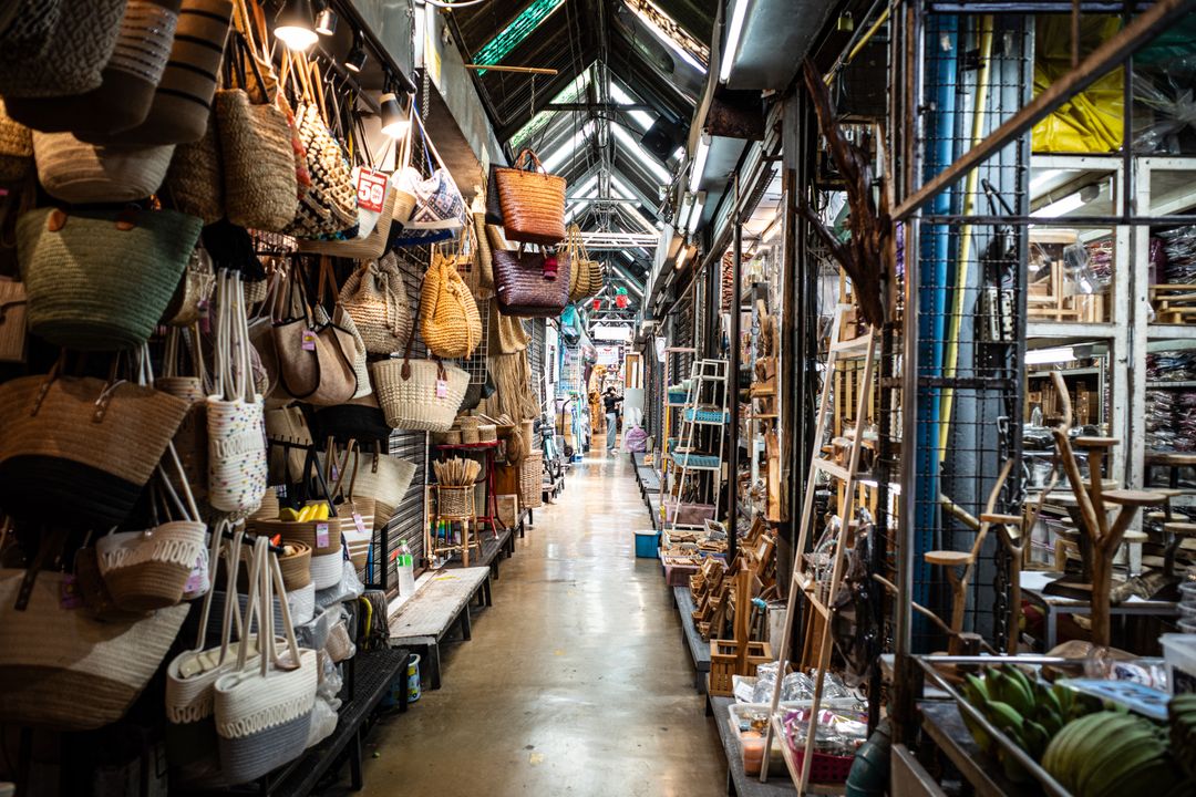 Market stalls filled with bags, crafts and souvenirs at Chatuchak Weekend Market in Bangkok