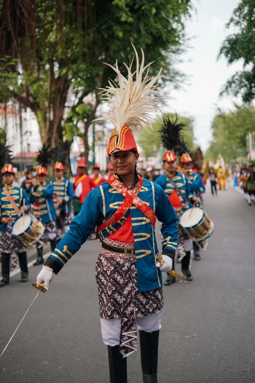 Free Colorful traditional parade in Yogyakarta featuring ceremonial costumes and drums. Stock Photo
