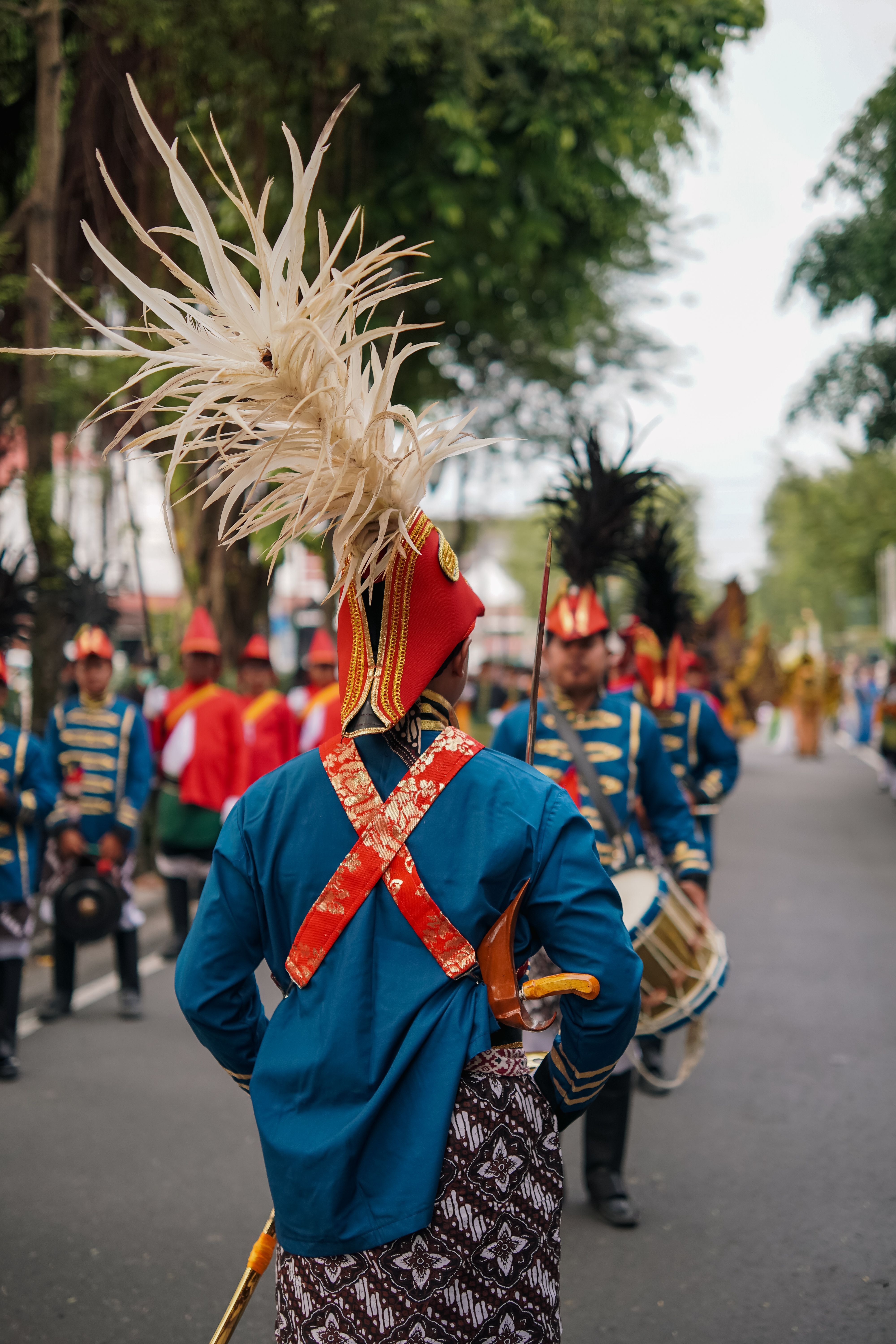 Colorful cultural parade in Yogyakarta showcasing traditional costumes and heritage. A vivid display of local culture.