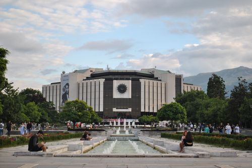 Free View of the National Palace of Culture with surrounding park and visitors in Sofia, Bulgaria. Stock Photo