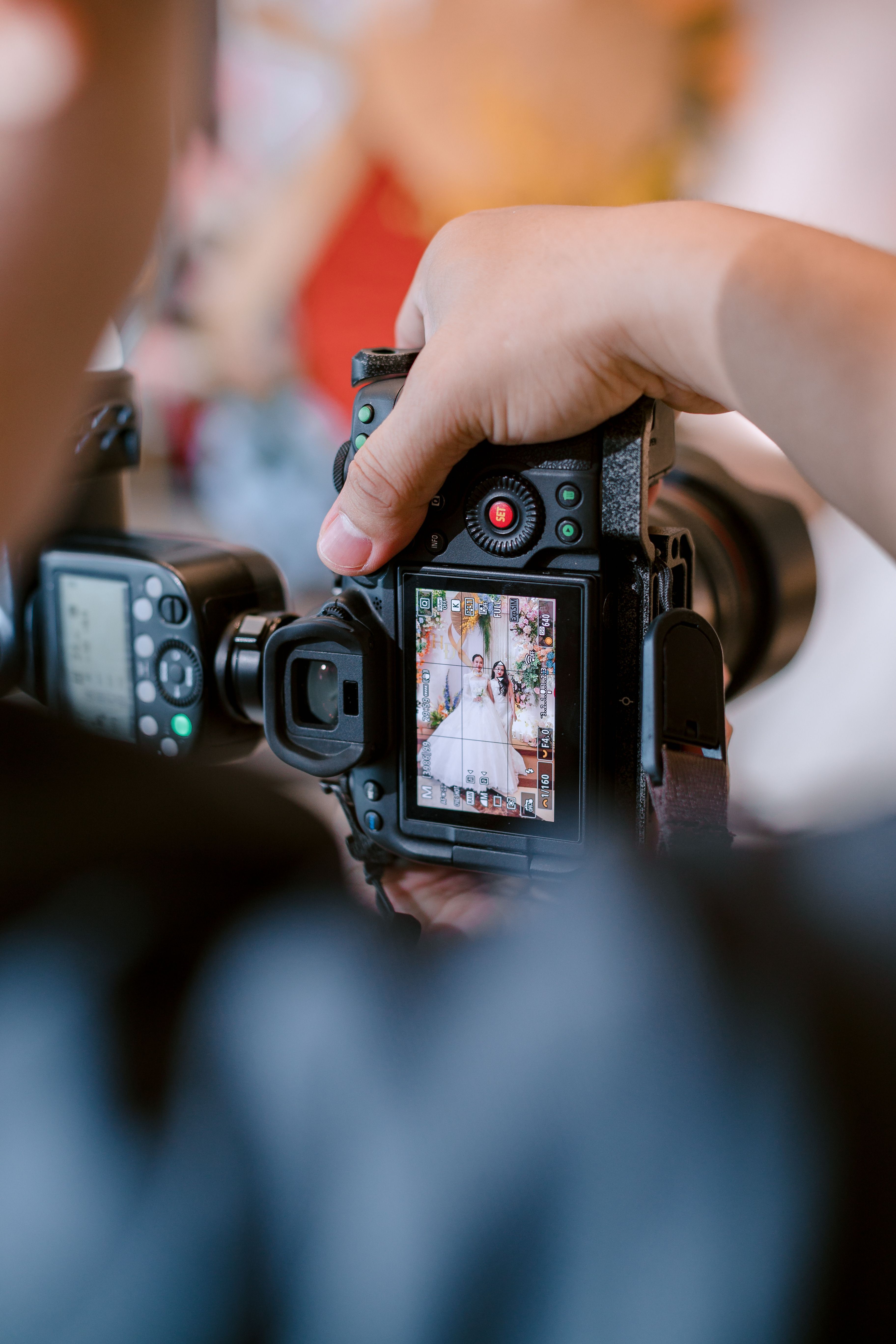 Capturing Wedding Moments with a Professional Camera · Free Stock Photo