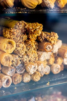 A vibrant display of assorted Ukrainian pastry rolls in Kyiv bakery.