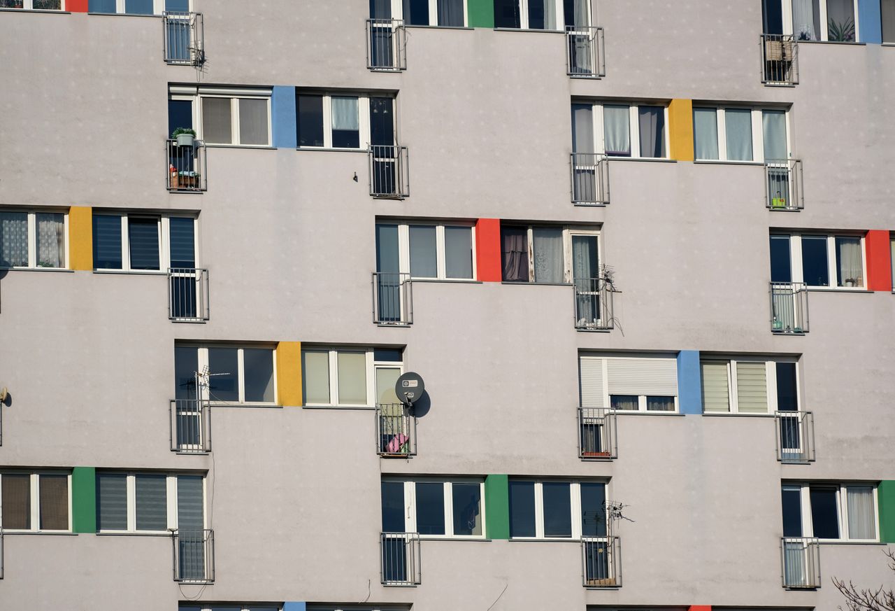 contemporary apartment building facade featuring geometric patterns an