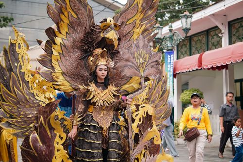 Free A vibrant cultural parade highlighting traditional costumes in Yogyakarta, Indonesia. Stock Photo