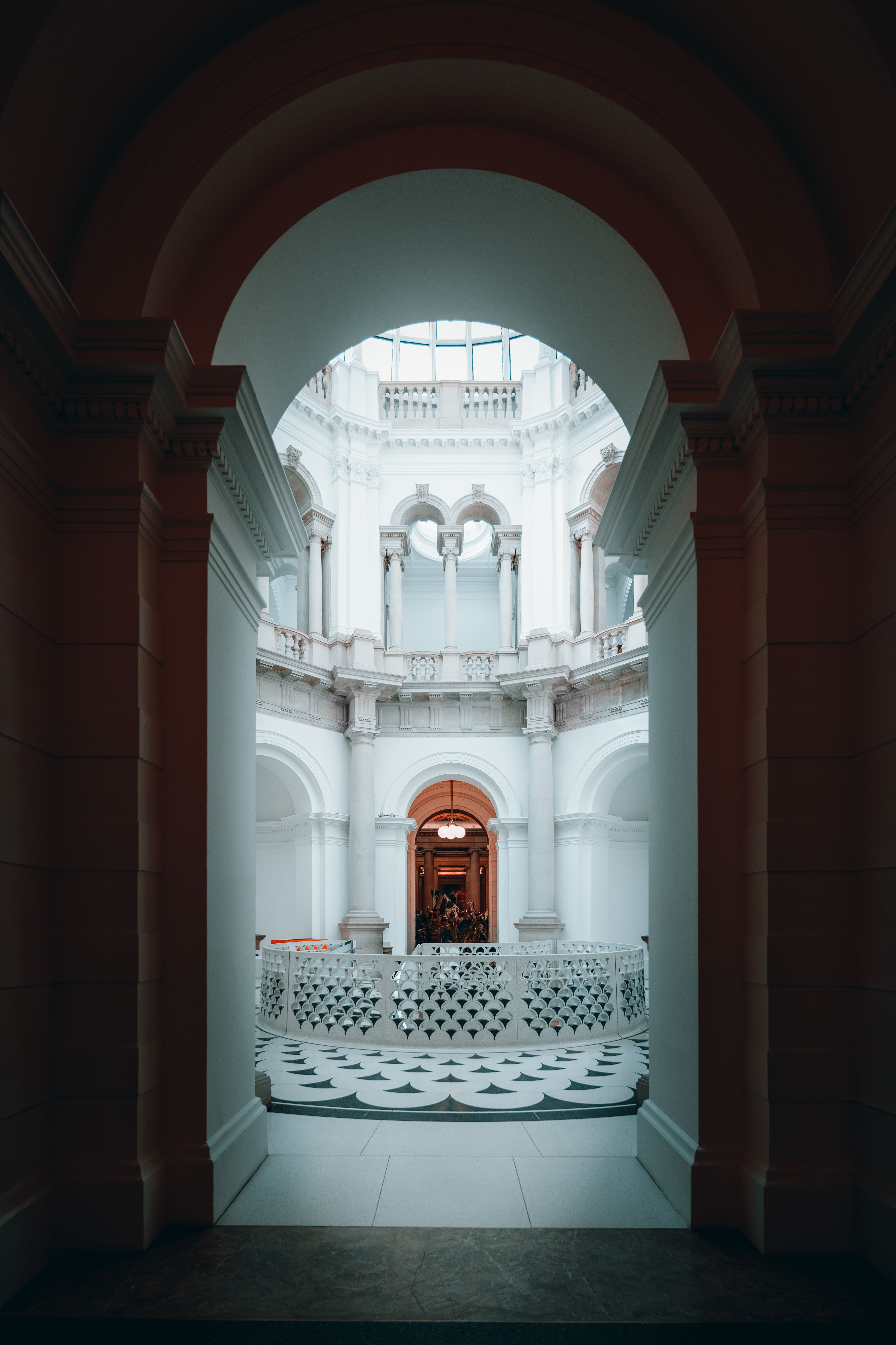 Explore the stunning architectural design of a historic museum interior in London, showcasing exquisite arches and detailing.