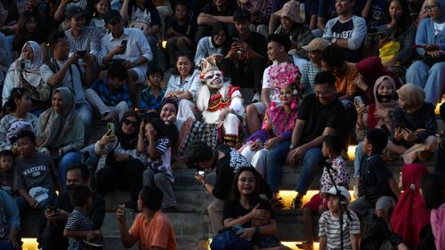 Free Colorful traditional performance with audience in Jakarta, Indonesia showcasing cultural attire and lively interaction. Stock Photo
