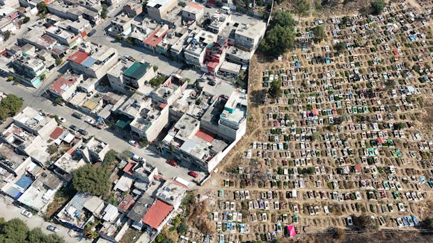 Aerial shot of an urban residential area next to a large cemetery in Estado de México, Mexico.