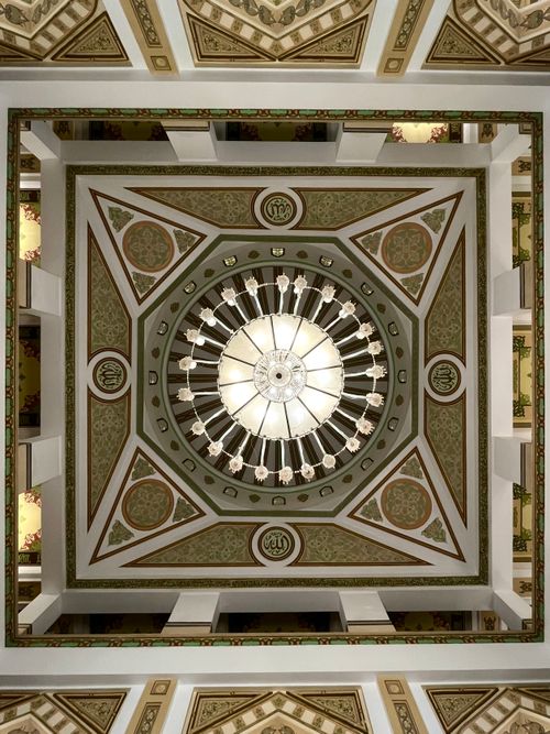Free Explore the ornate geometric patterns of a mosque ceiling in Cairo, Egypt. Stock Photo