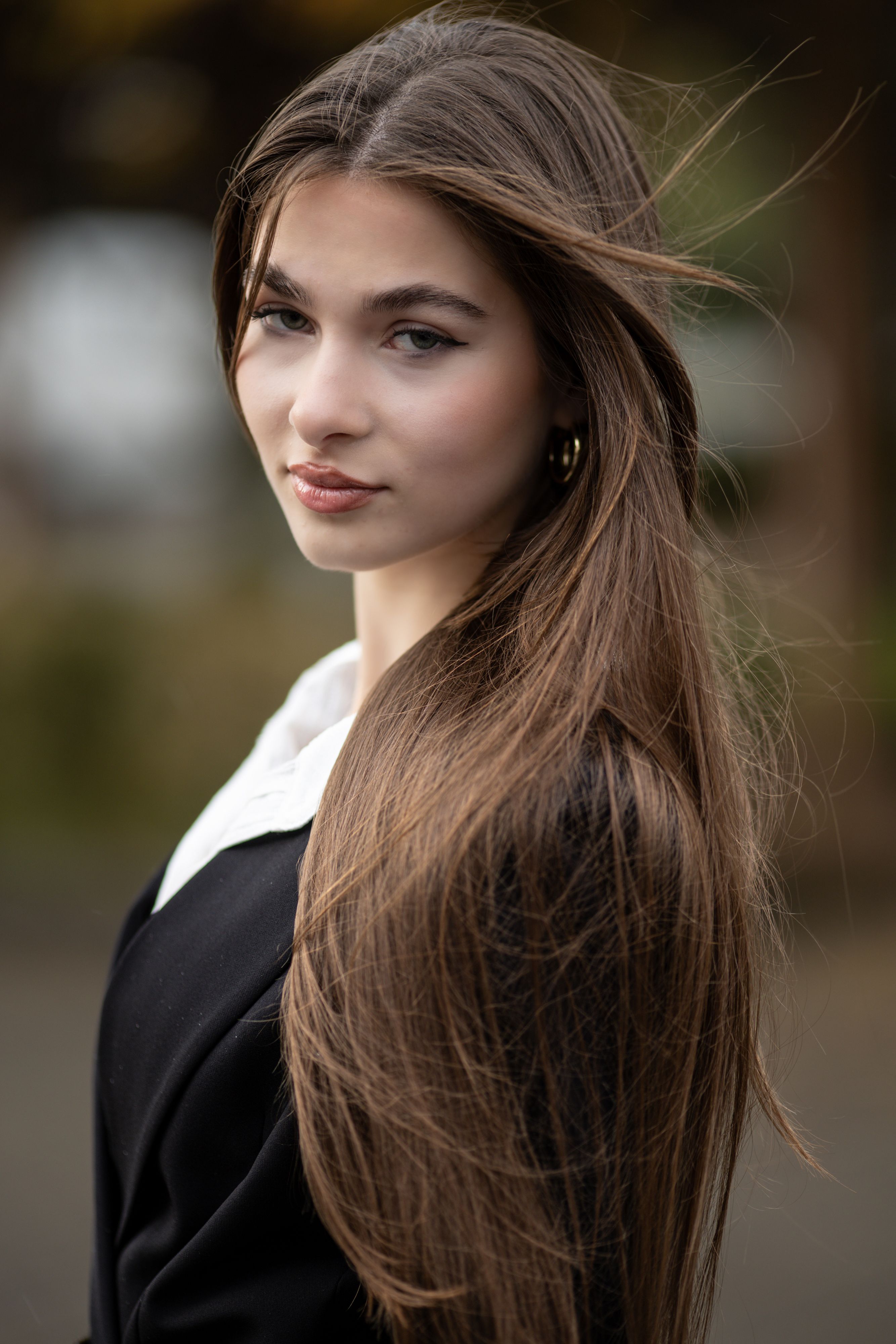 Sophisticated portrait showcasing natural beauty with soft lighting.