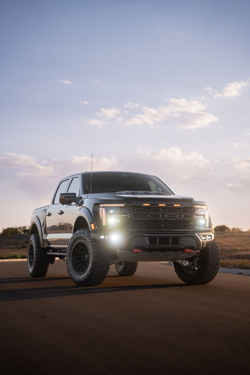Lifted pickup truck with all-terrain tires