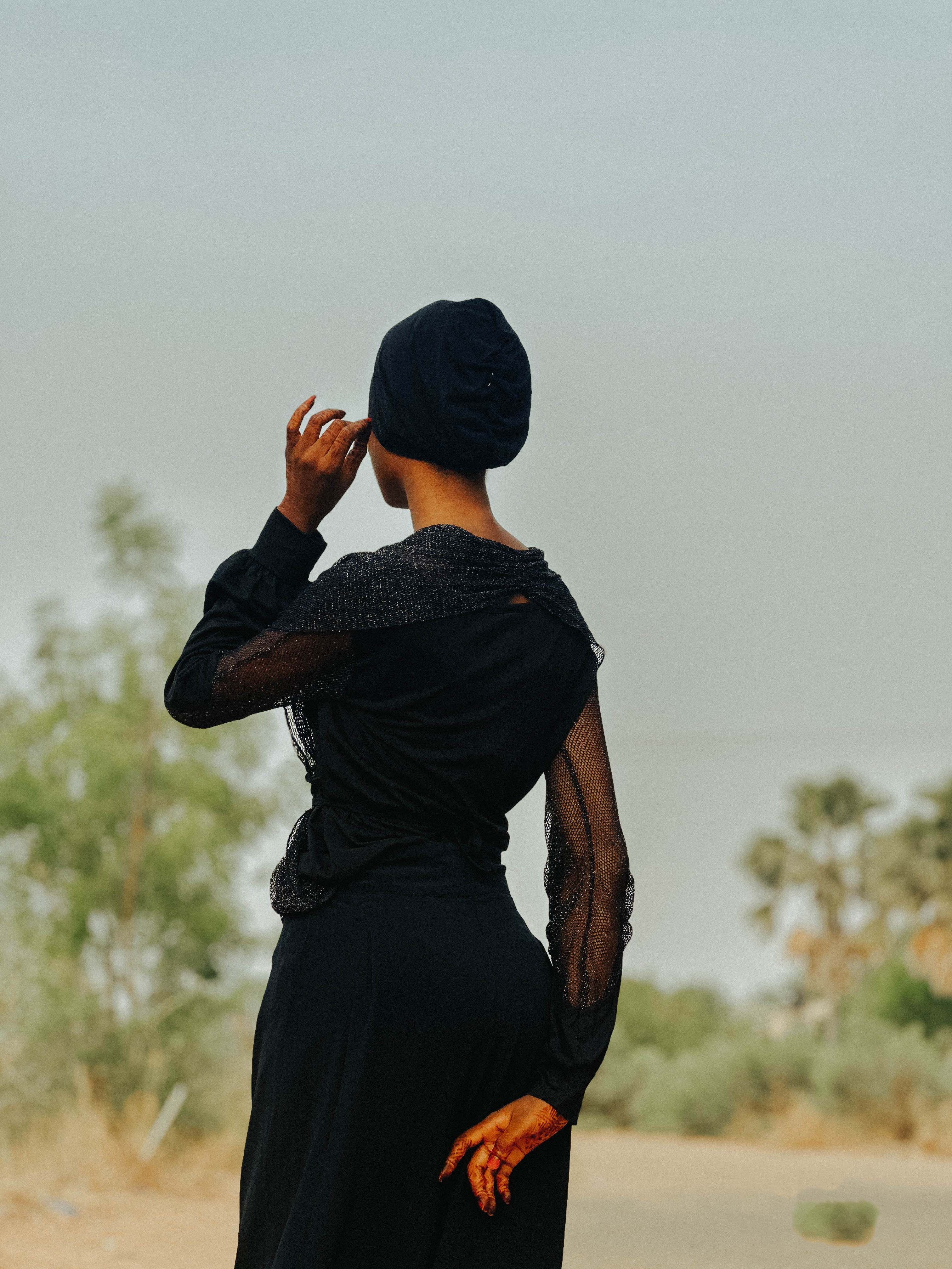 Elegant Woman in Black Dress Outdoors · Free Stock Photo