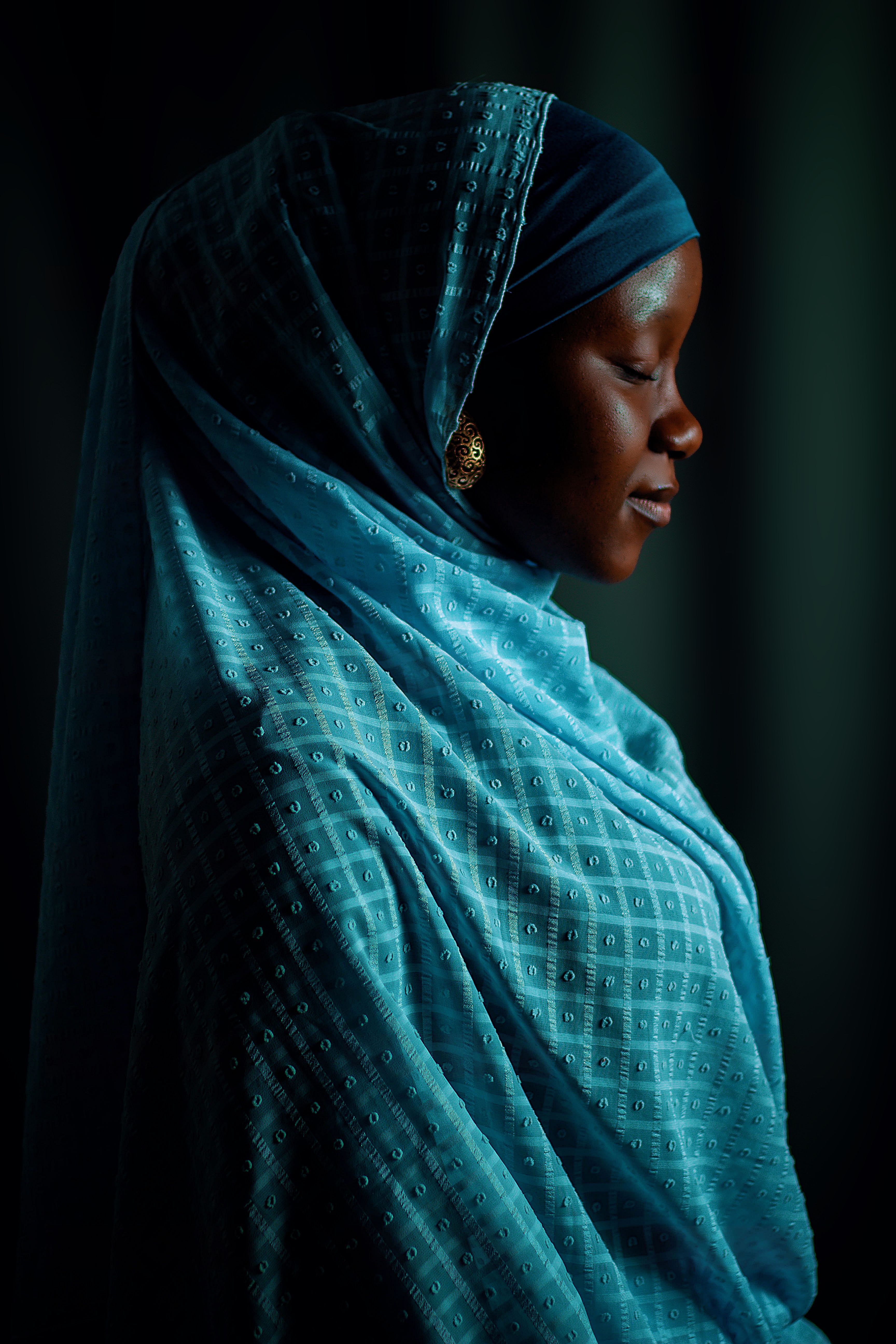 Portrait of a Woman in Traditional Blue Hijab · Free Stock Photo