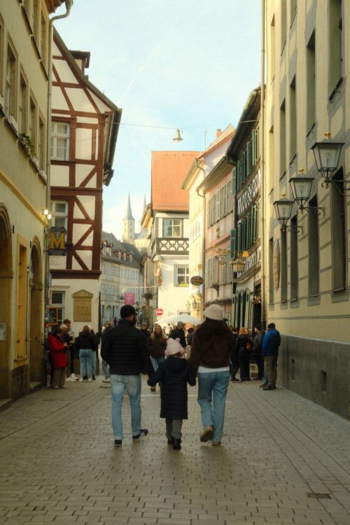 Free Charming street scene in Bamberg, Germany, showcasing historic architecture and lively atmosphere. Stock Photo