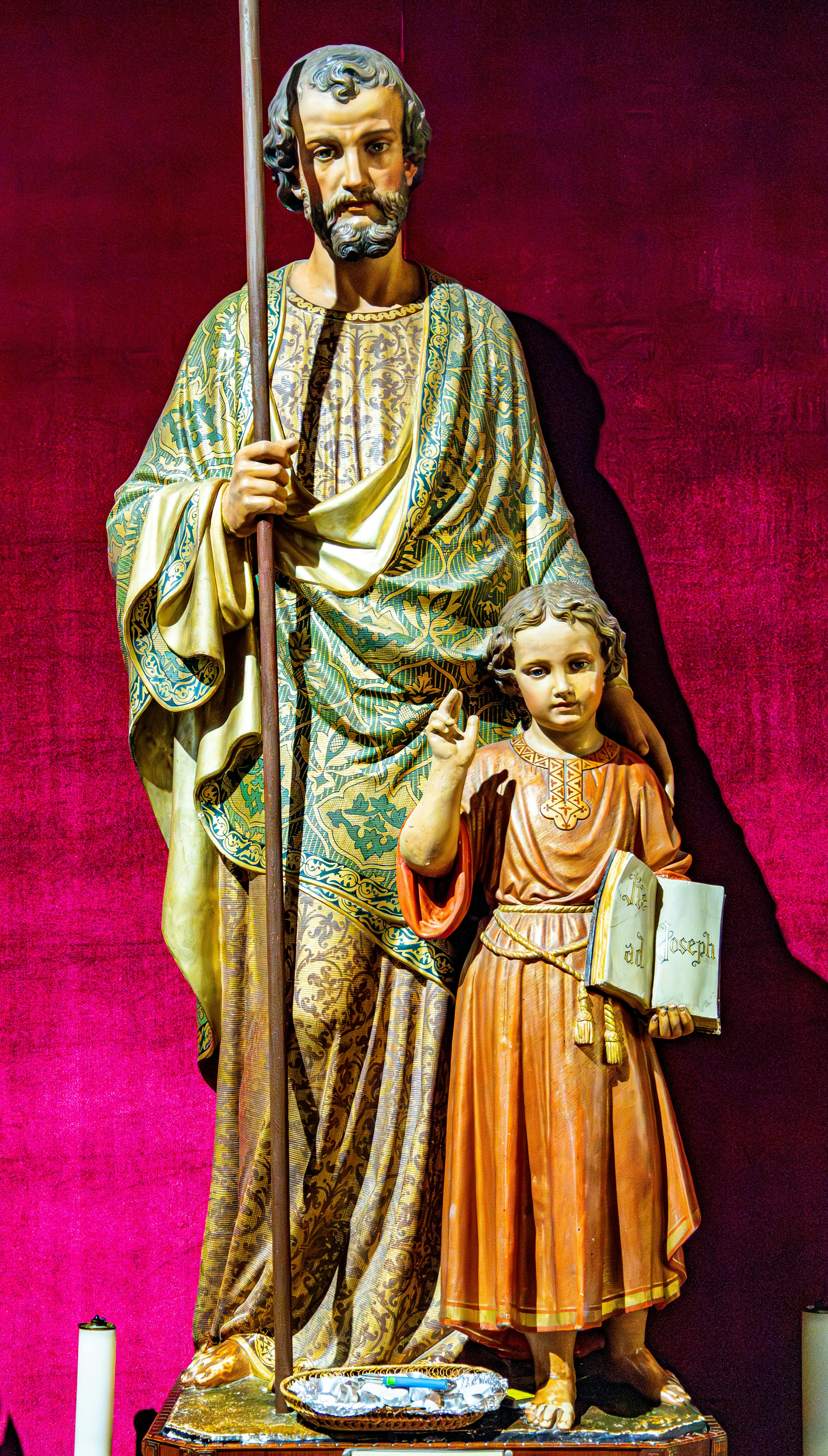 Colorful religious statues of saints in a church in Nazareth, Israel.