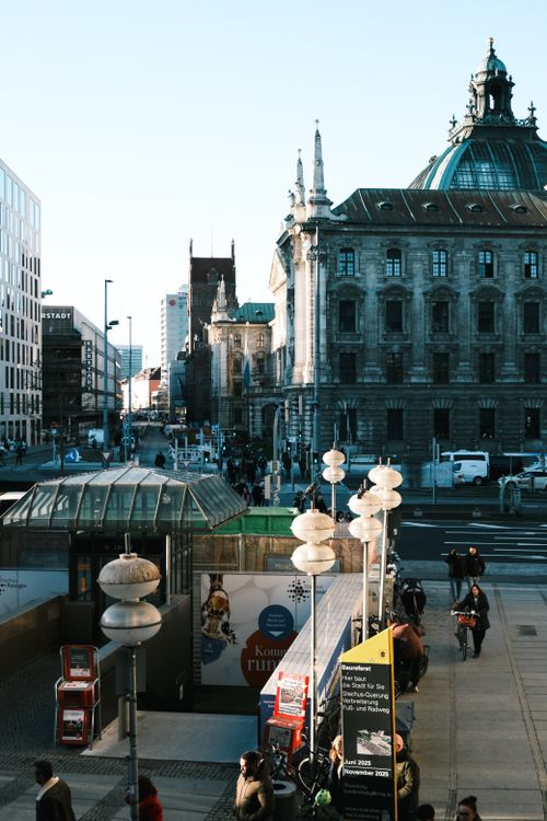 Free Crowded city square with historic architecture and busy street life, in daytime. Stock Photo