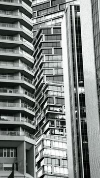 High-rise buildings showcasing modern architectural design in black and white.