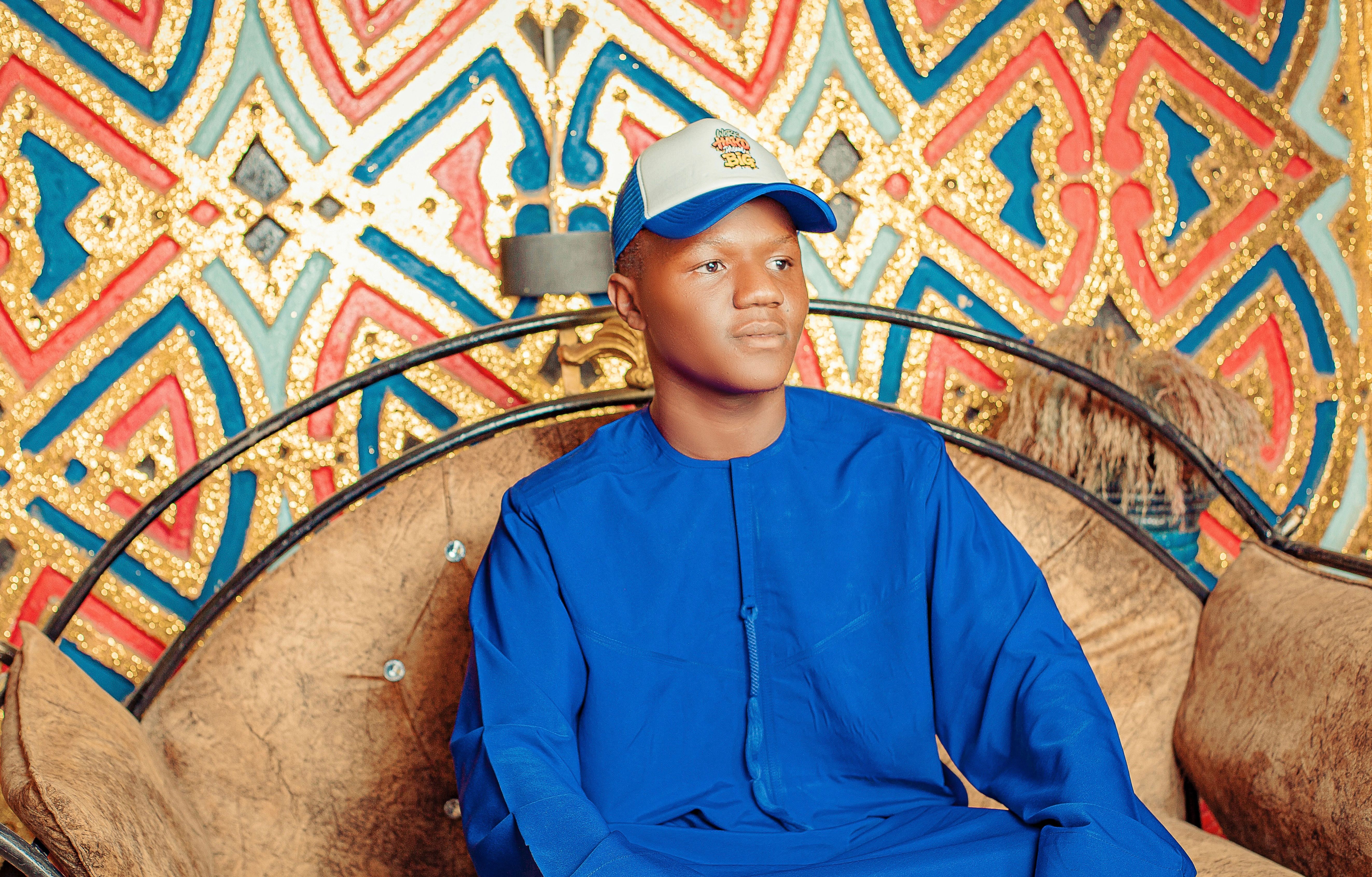 Young Man in Blue Traditional Attire