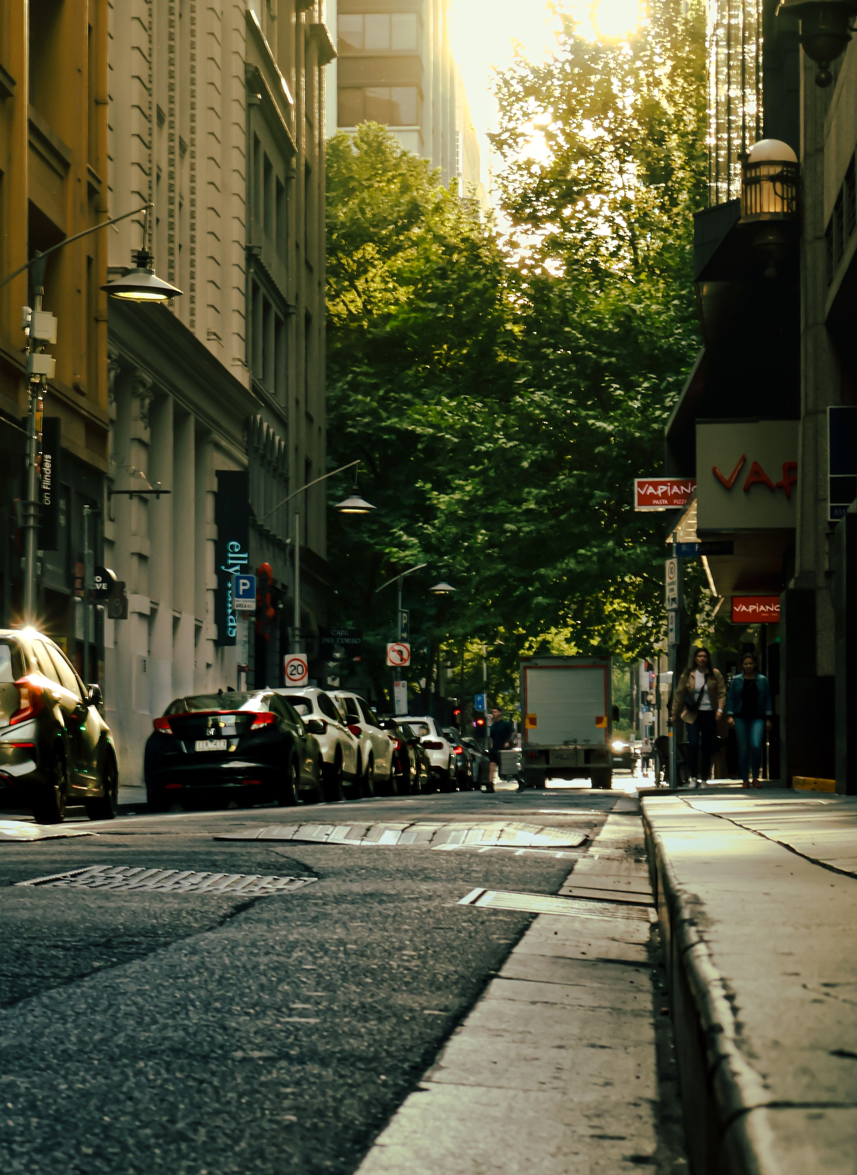 Urban Street Scene with Cars at Dusk · Free Stock Photo