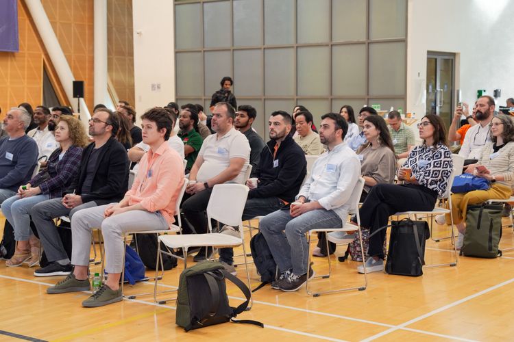 Community members listening at a local gathering