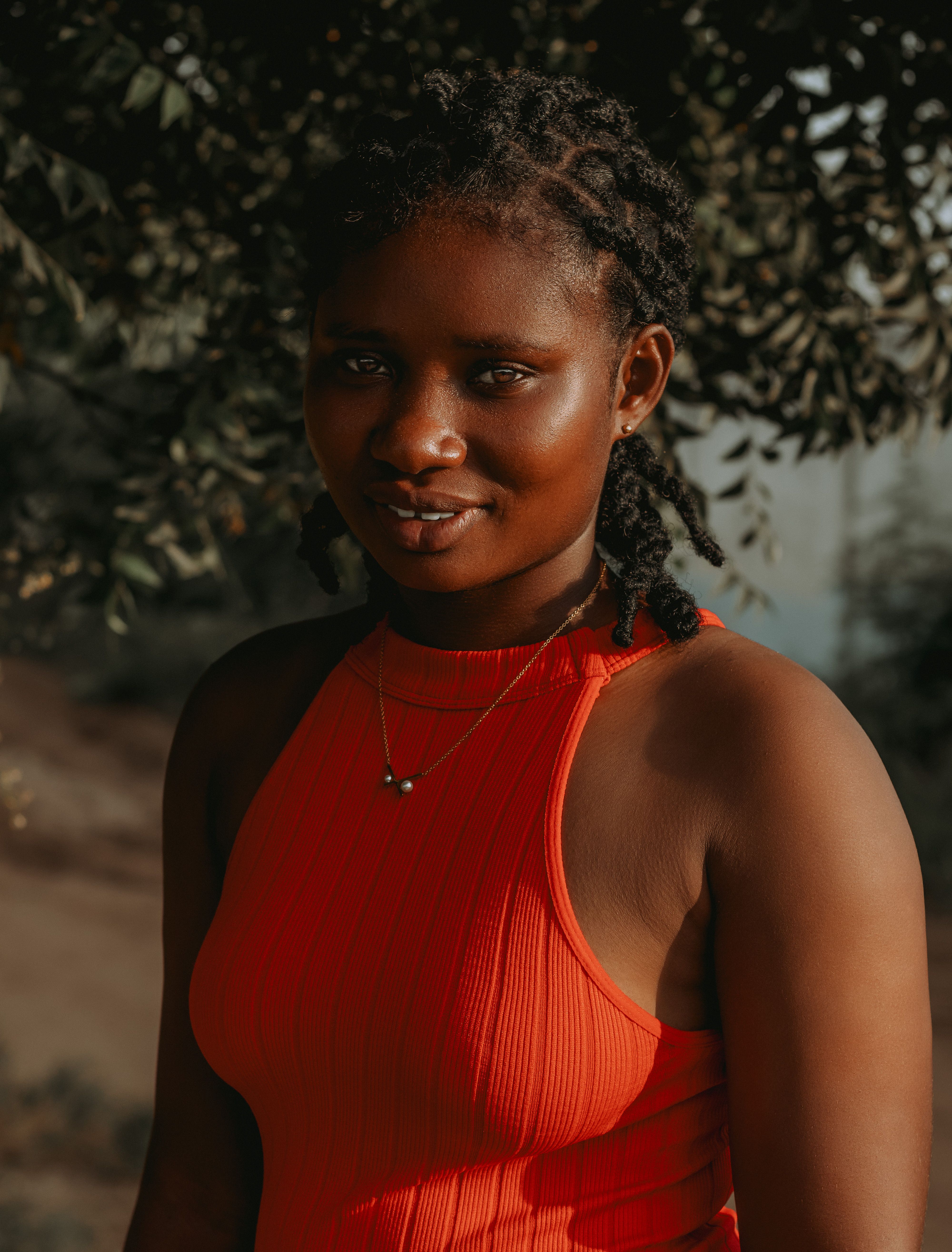 Portrait of a Young Woman in a Red Dress Outdoors · Free Stock Photo