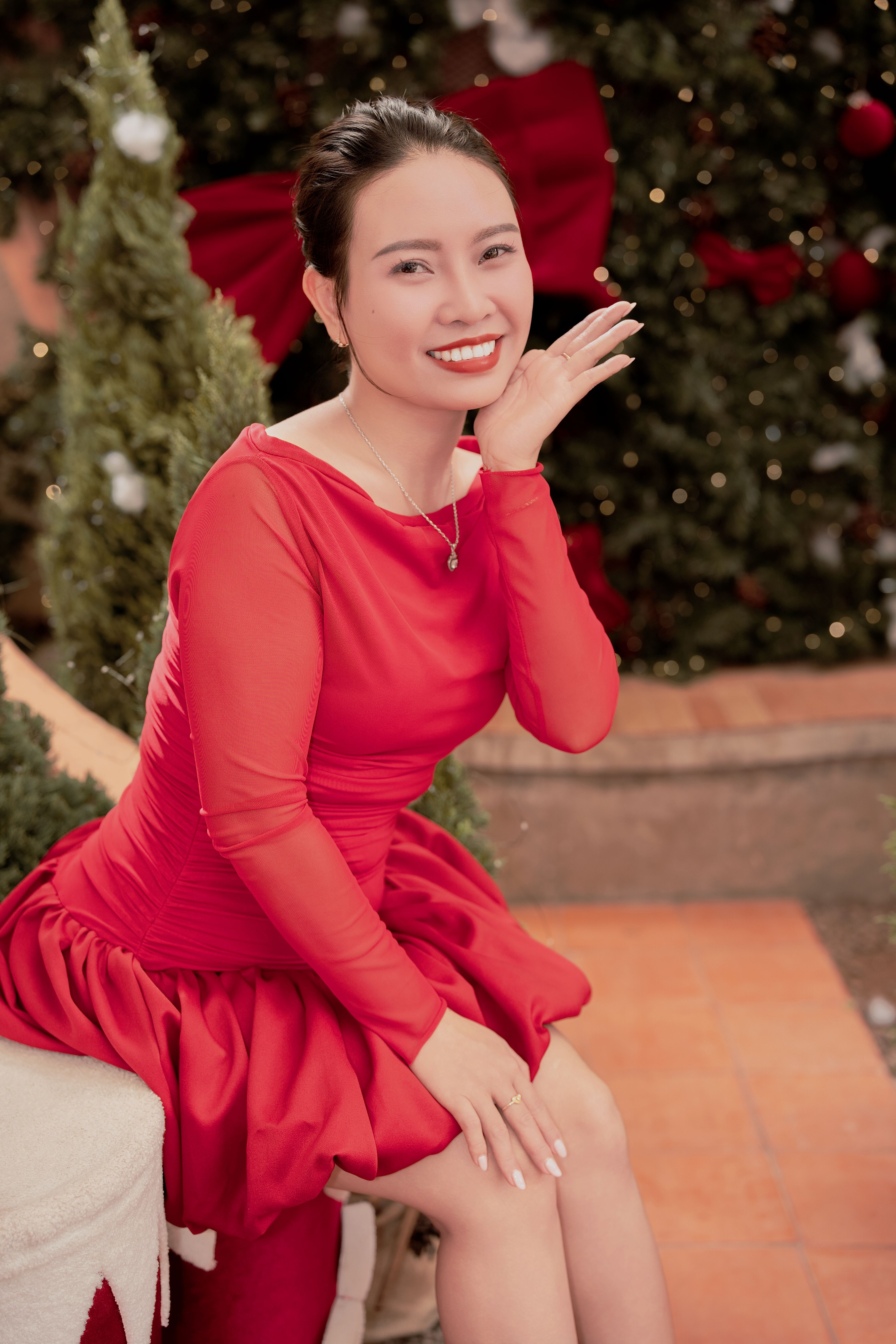 Woman in Red Dress Smiling at Christmas · Free Stock Photo