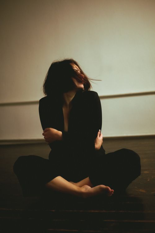 Moody Portrait of a Woman in Shadow · Free Stock Photo