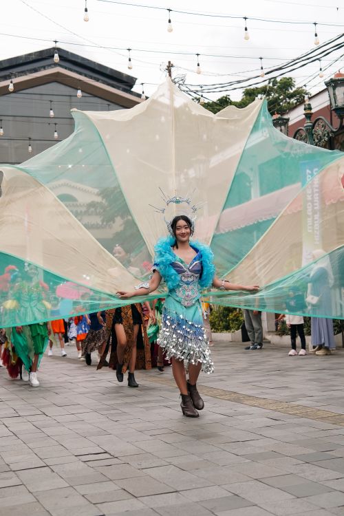 Free Vibrant cultural parade featuring colorful costumes in Yogyakarta, Indonesia. Stock Photo