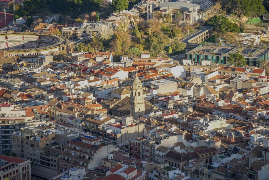 Ultimate Barcelona: Helicopter, Boat Ride & Old Town Small Group (Max 8) Review 2026 - Stunning aerial view of Jaén, showcasing historic architecture and vibrant city life.