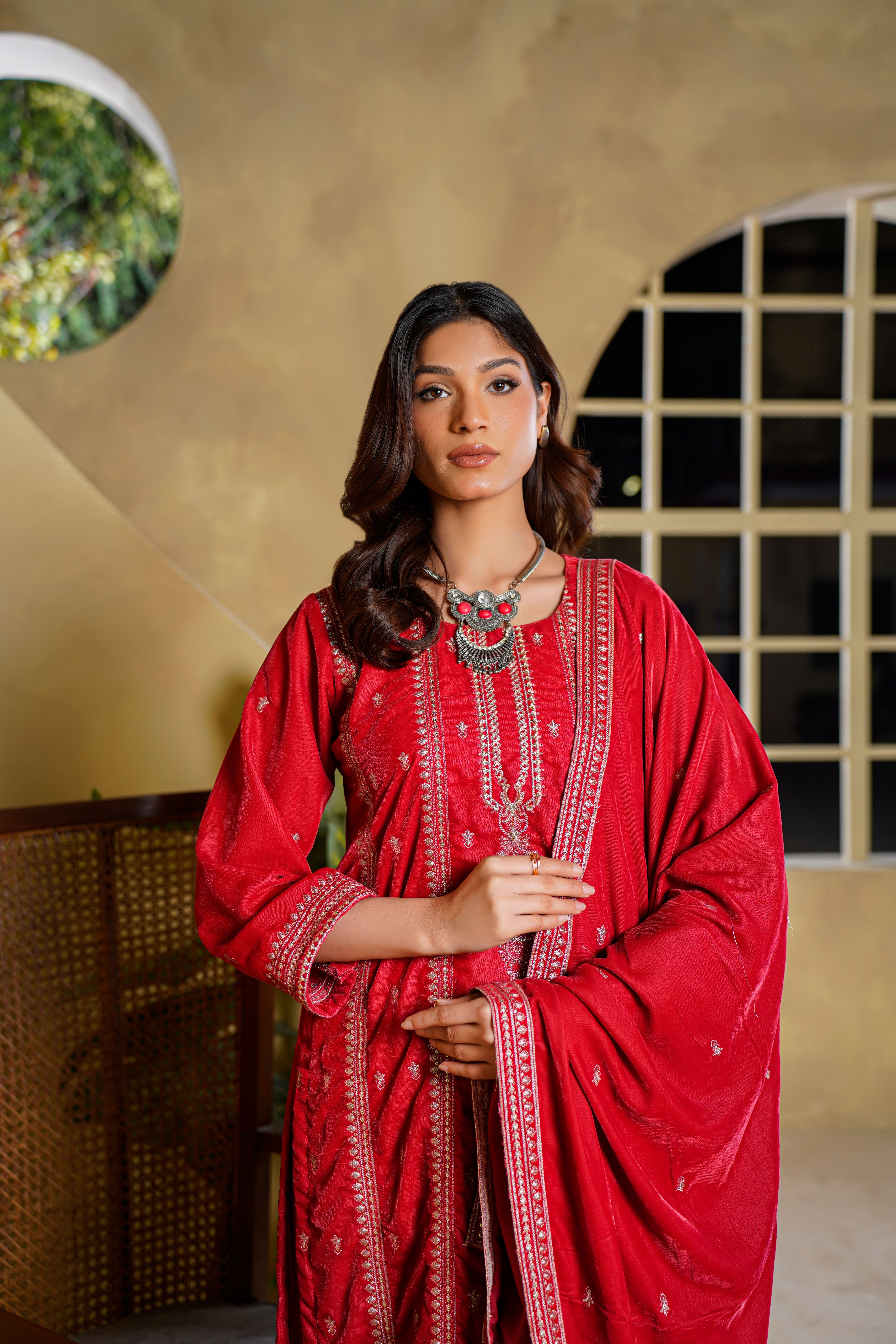 Elegant Woman in Traditional Red Velvet Dress · Free Stock Photo