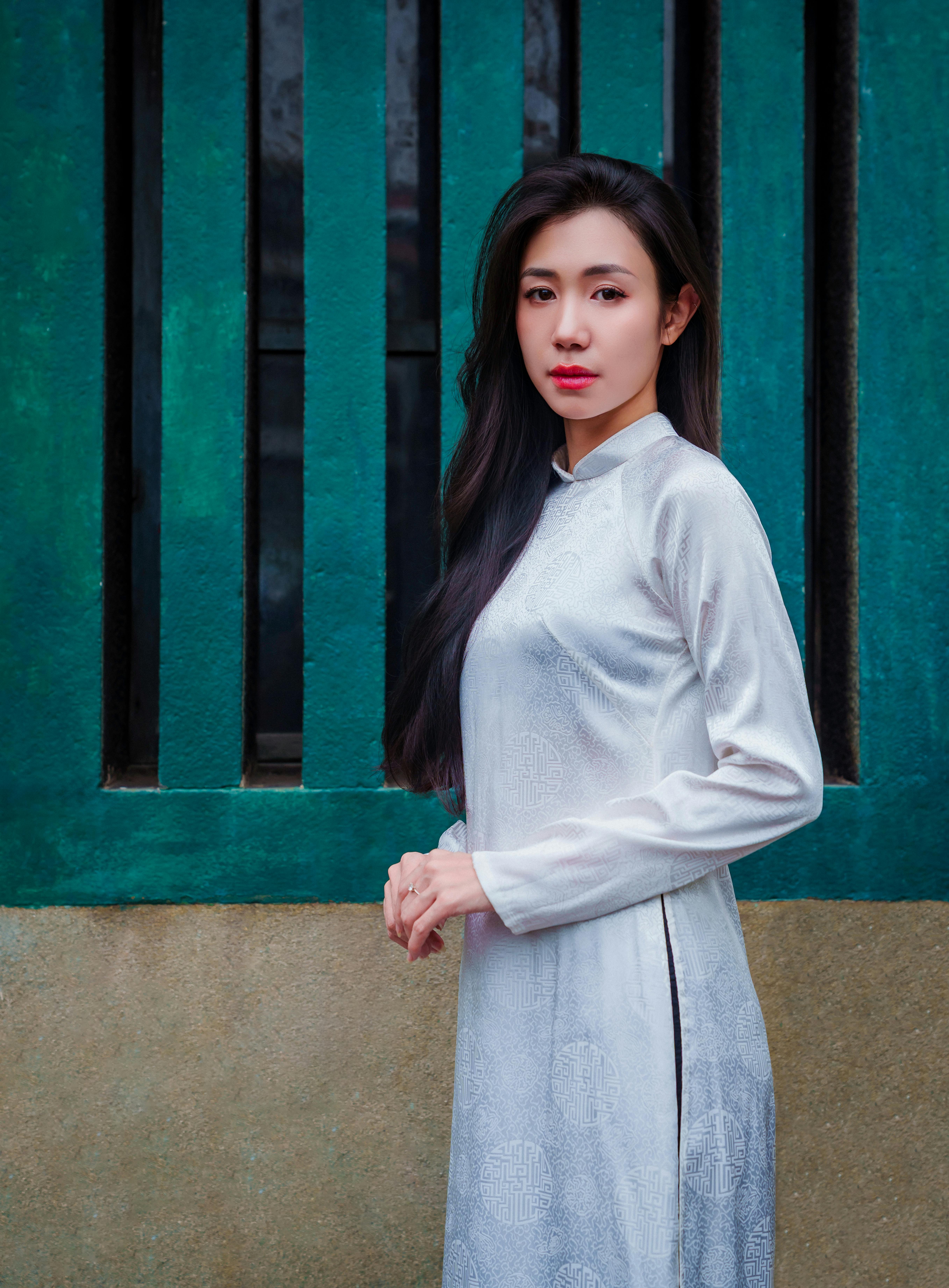 Elegant woman in traditional áo dài in Ho Chi Minh City, Vietnam.