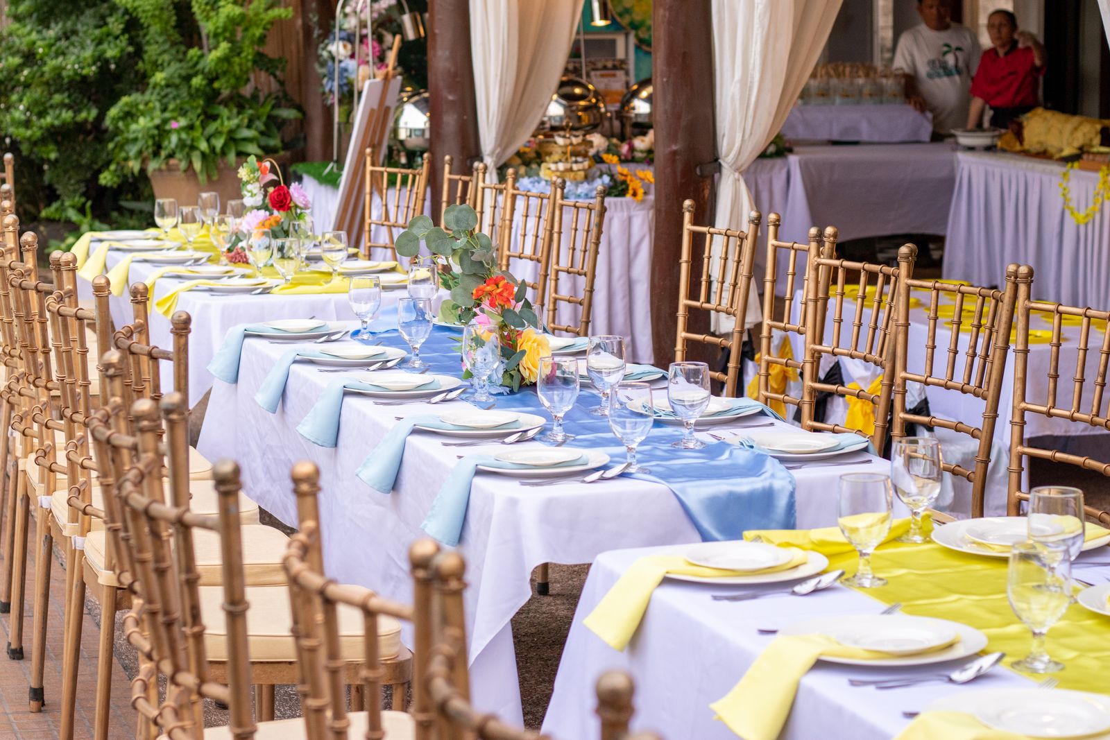 Gold Chiavari chairs lined for an elegant reception