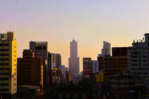 Free Twilight view of Kaohsiung city skyline featuring tall buildings and a sunset ambiance. Stock Photo
