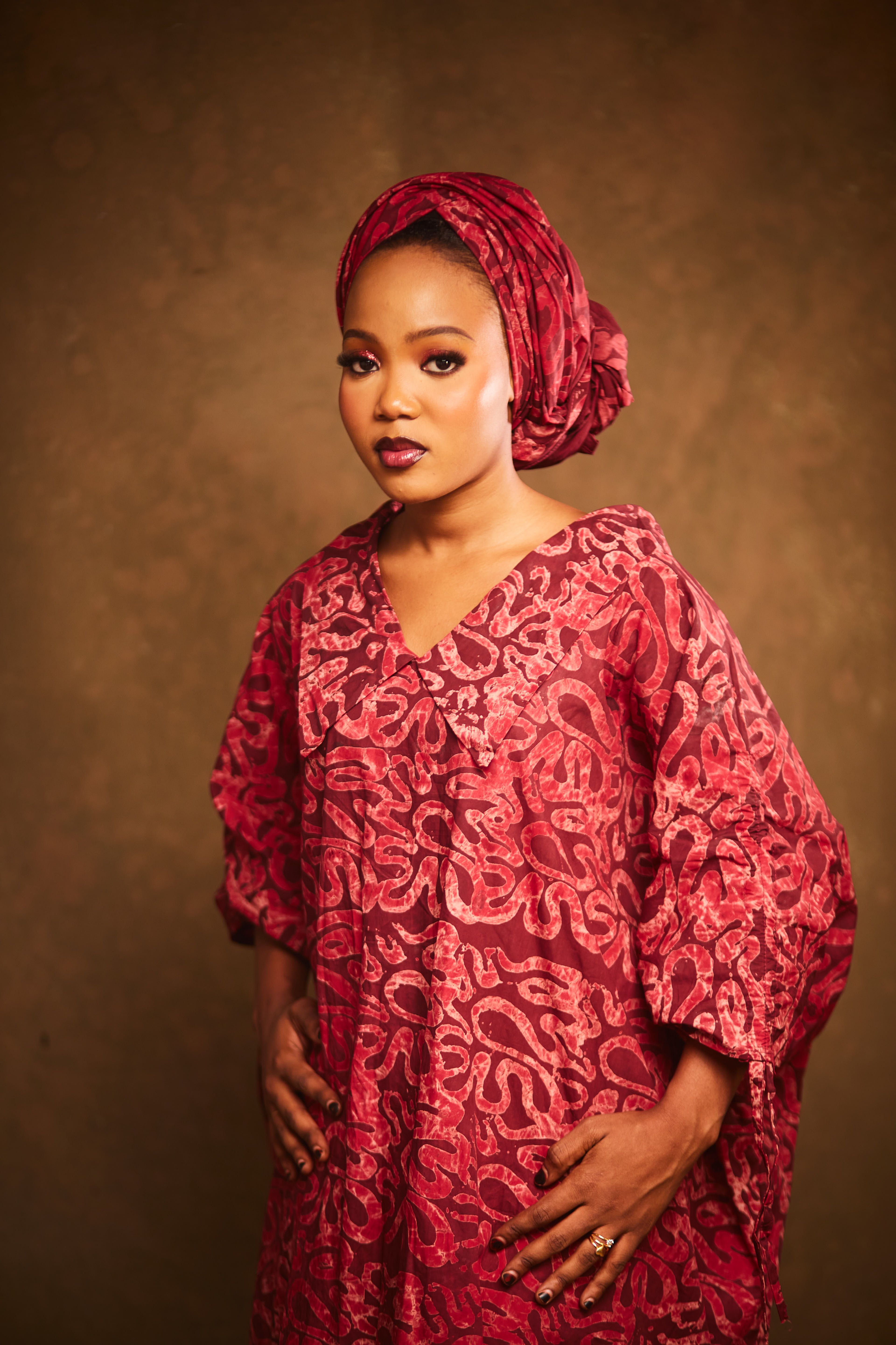 Elegant Portrait of a Woman in Red Traditional Dress · Free Stock Photo