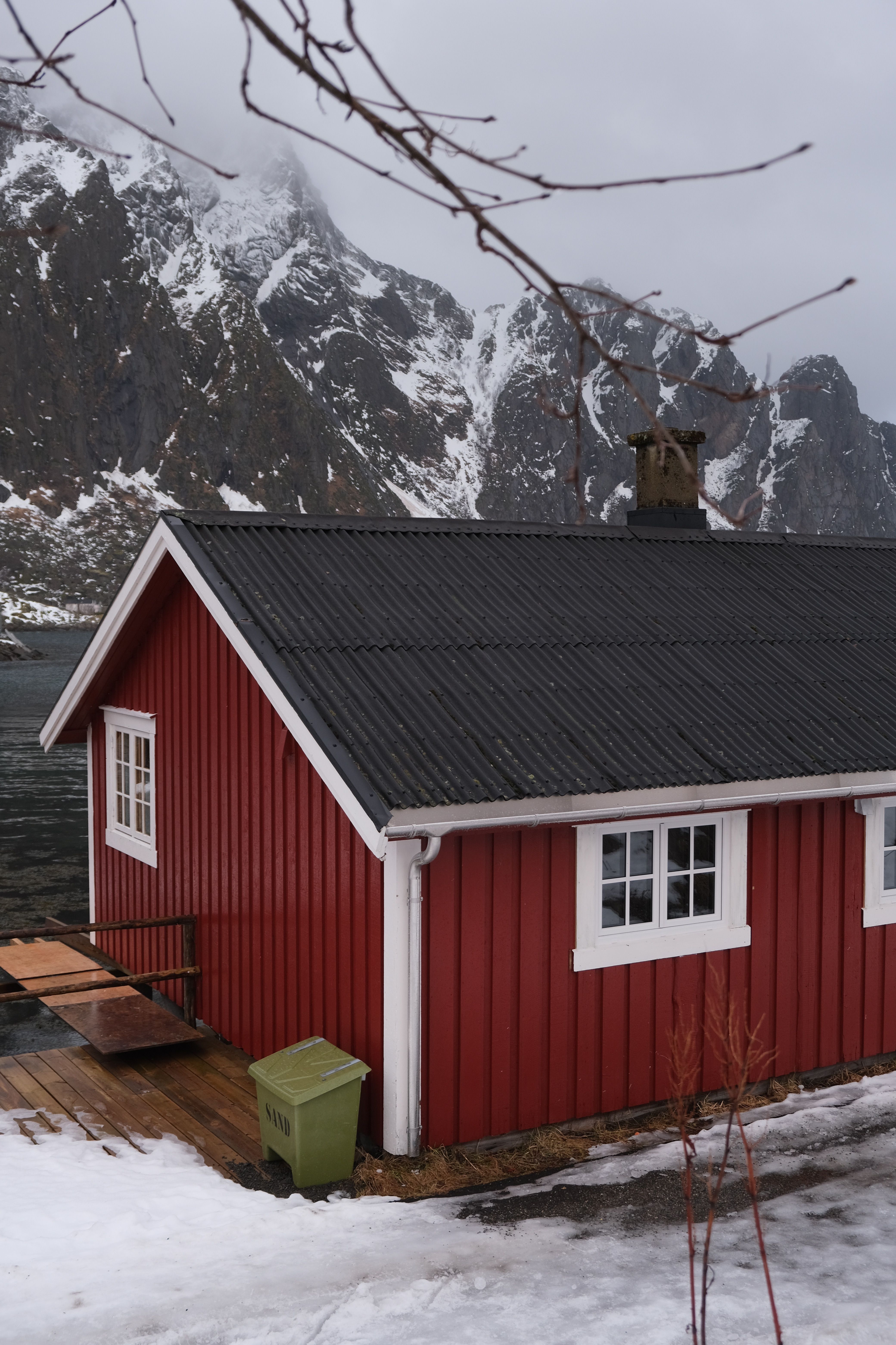 Charming Red Cabin in Snowy Mountainous Landscape · Free Stock Photo