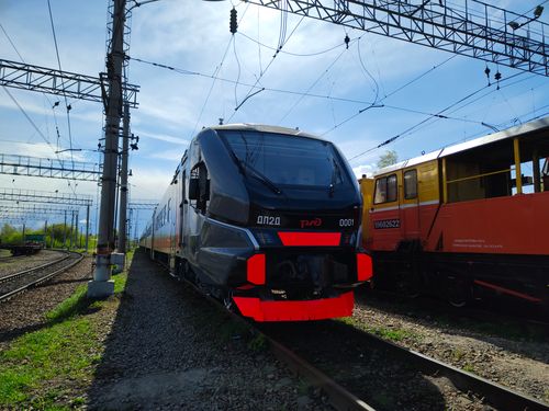 Free A modern Russian train captured under clear skies on railway tracks, highlighting advanced technology. Stock Photo