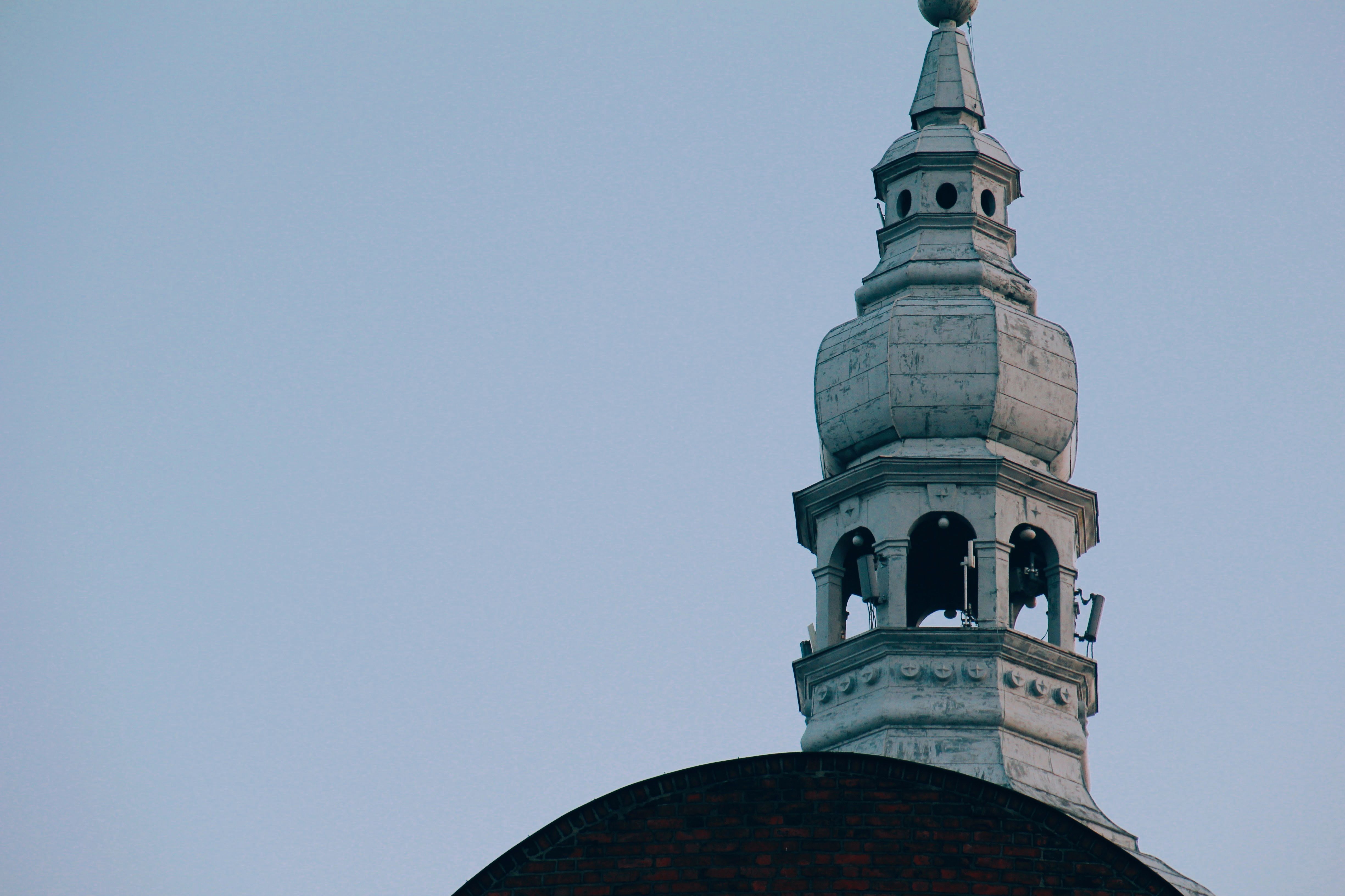 Historic Church Tower Against Blue Sky · Free Stock Photo