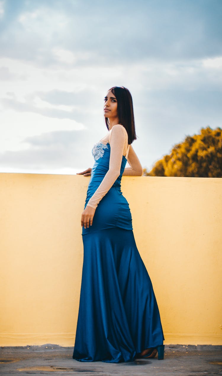 Elegant Woman In Blur Dress Standing On Terrace