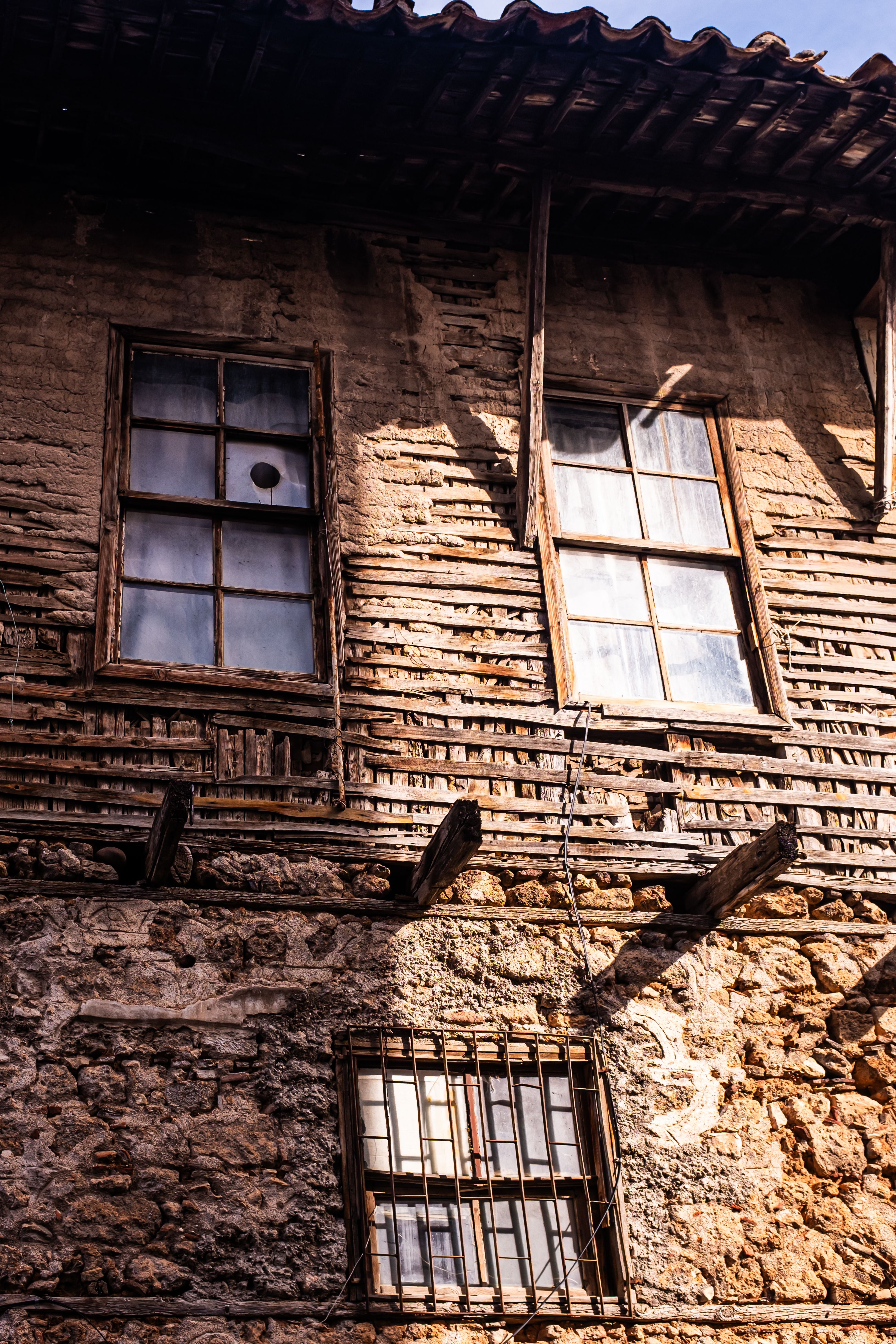 Rustic Old Building with Wooden Windows and Stone Walls · Free Stock Photo